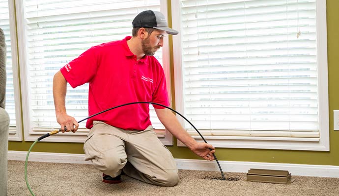 A professional cleaning HVAC air vent