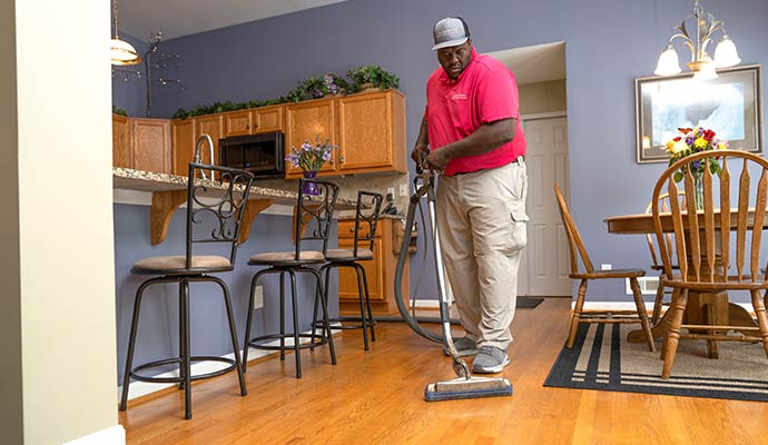 Teasdale Fenton of Tampa professional cleaning a wooden floor