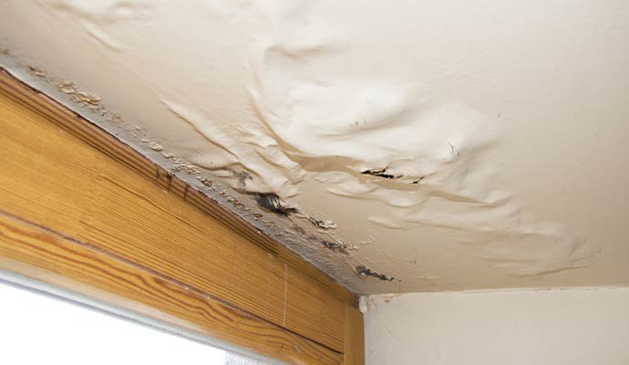 Water damaged ceiling due to roof leak
